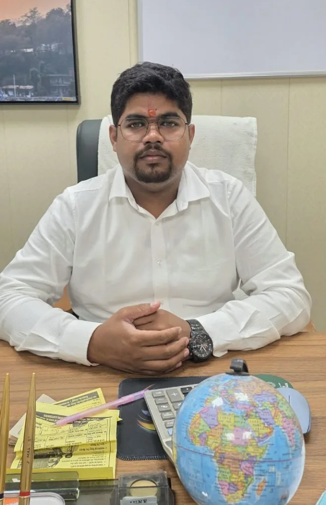 Dr. S. K. Sharma seated at his desk